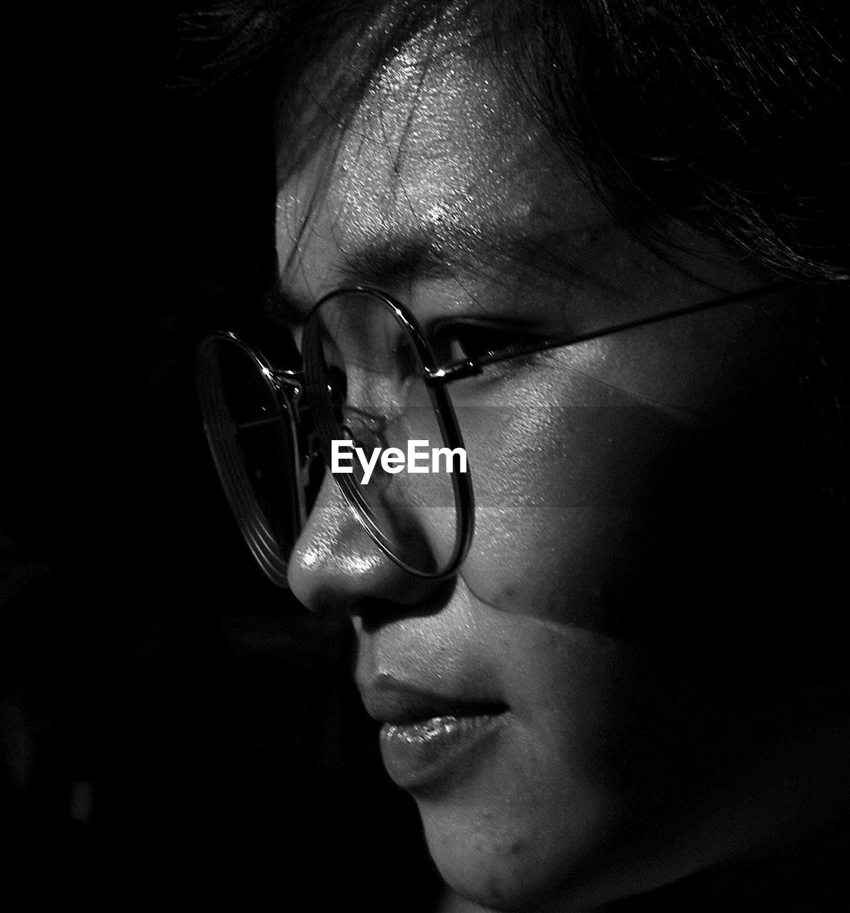 black, darkness, glasses, one person, white, portrait, vision care, close-up, black and white, human face, headshot, eyeglasses, adult, monochrome, monochrome photography, eyewear, women, human head, indoors, young adult, human eye, nose, lifestyles, female, black background, looking, fashion, sunglasses, looking away, dark, studio shot, smiling, person, portrait photography