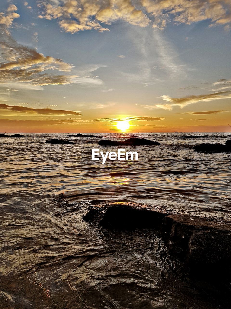 Scenic view of sea against sky during sunset