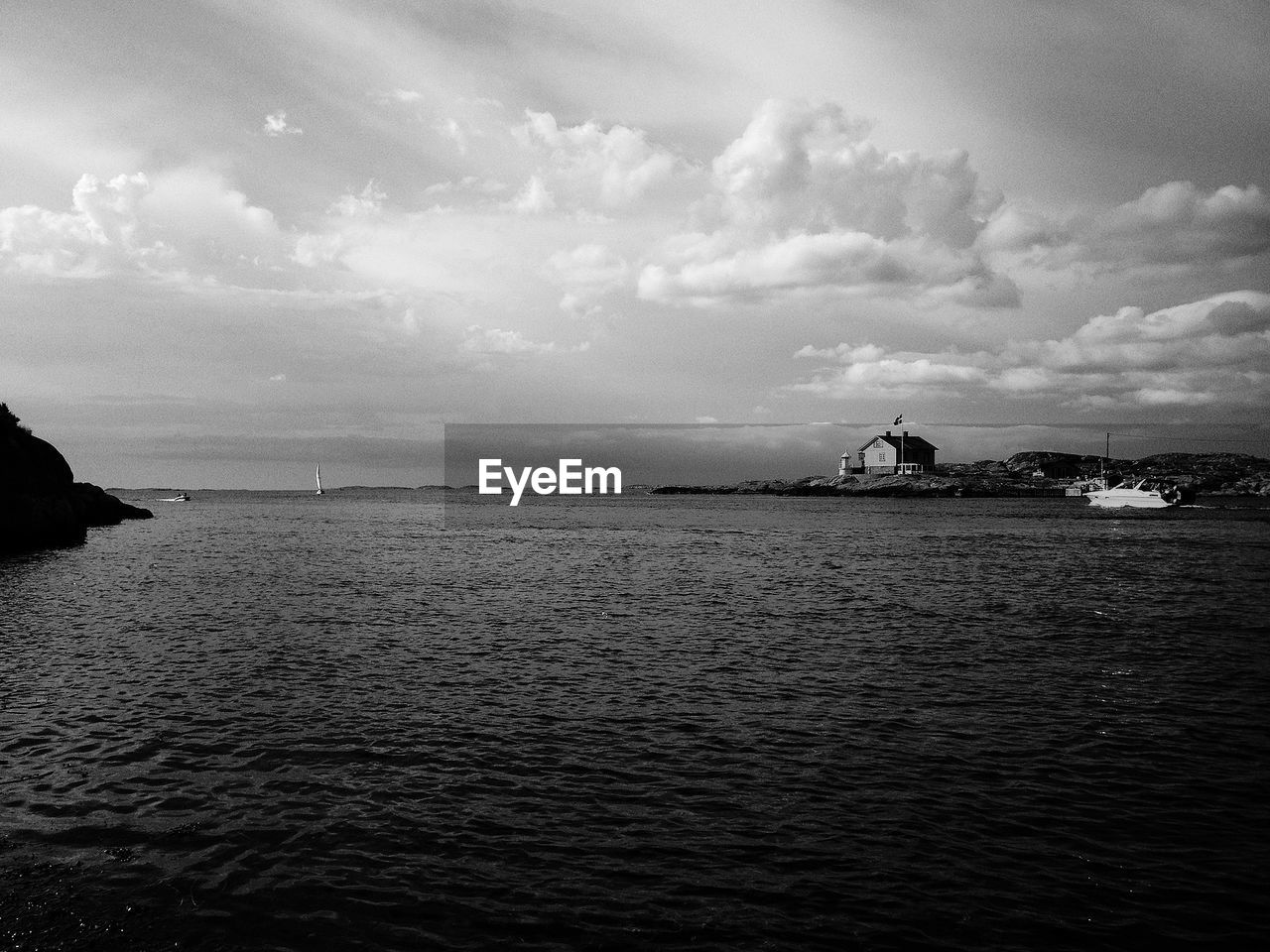 Scenic view of sea against cloudy sky