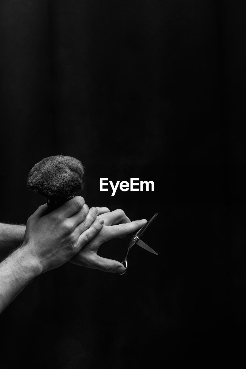 hand, darkness, black and white, black, one person, holding, monochrome photography, monochrome, adult, black background, close-up, indoors, copy space, studio shot, men