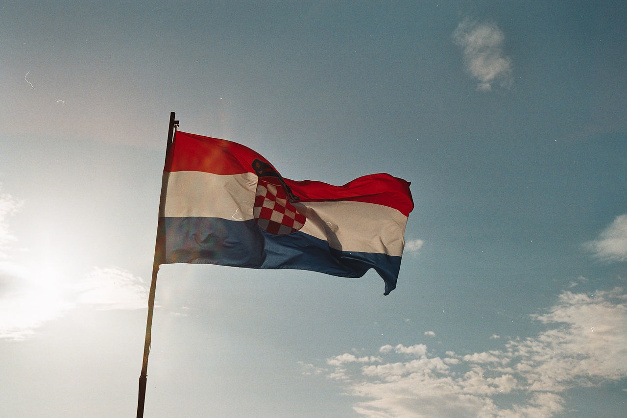 Low angle view of croatian flag against sky