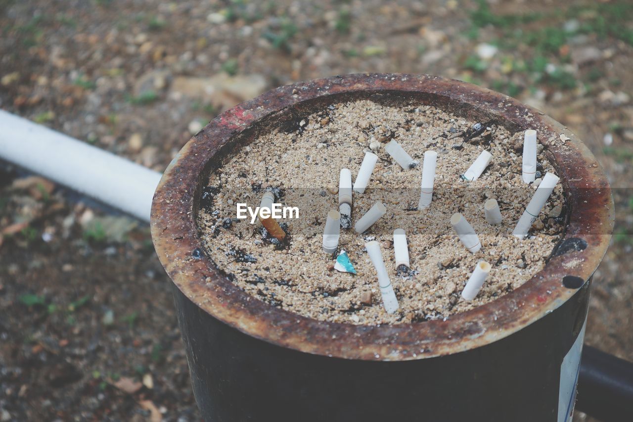 High angle view of cigarette smoking on metal