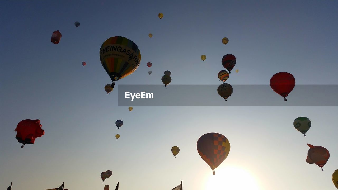 LOW ANGLE VIEW OF BALLOONS AGAINST SKY