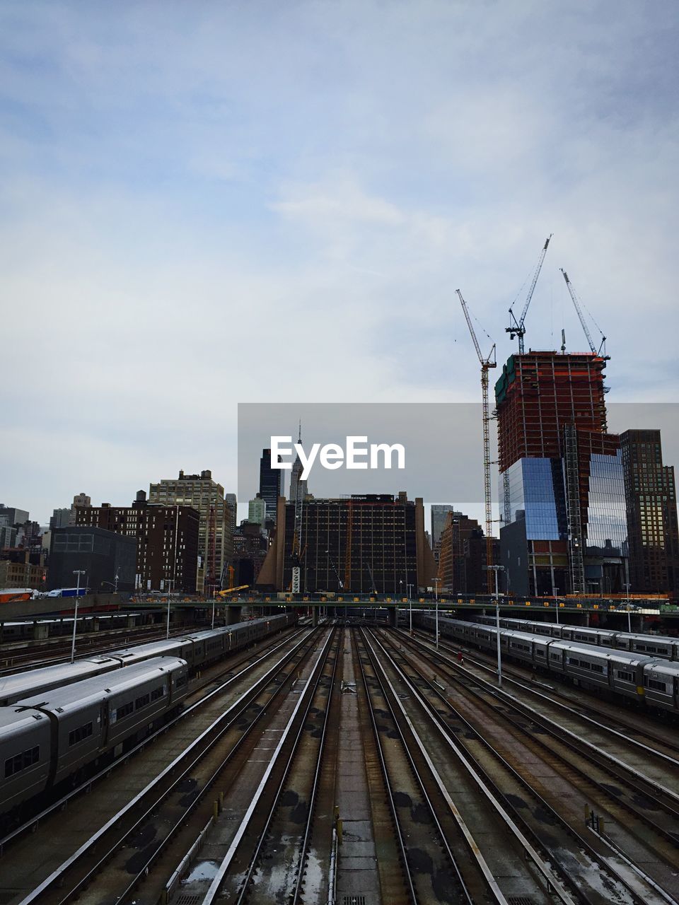 High angle view of railway tracks against buildings