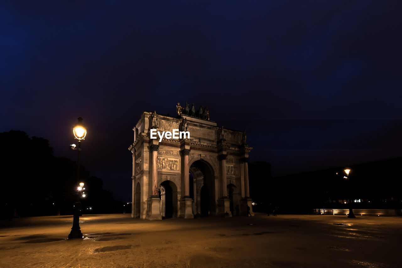 VIEW OF ILLUMINATED BUILDING AT NIGHT