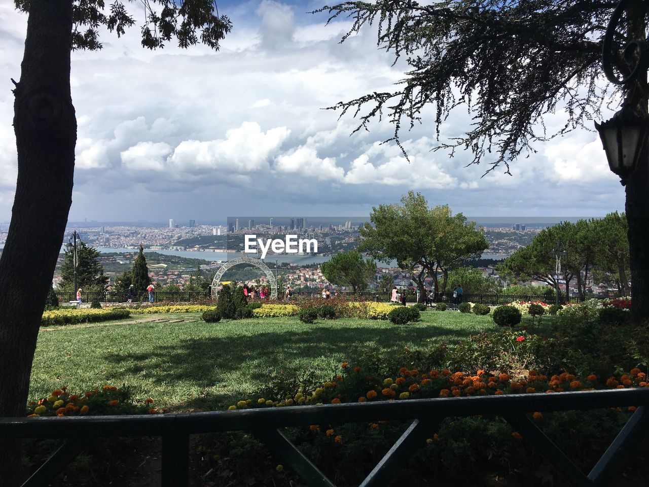 View of town against cloudy sky