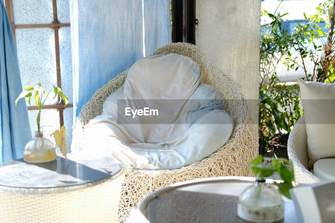 White cushion pillow on chair sofa seat at patio at home