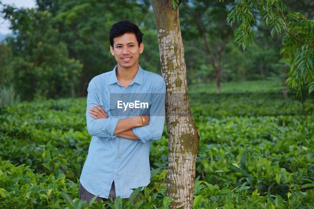 Portrait of smiling man standing in farm