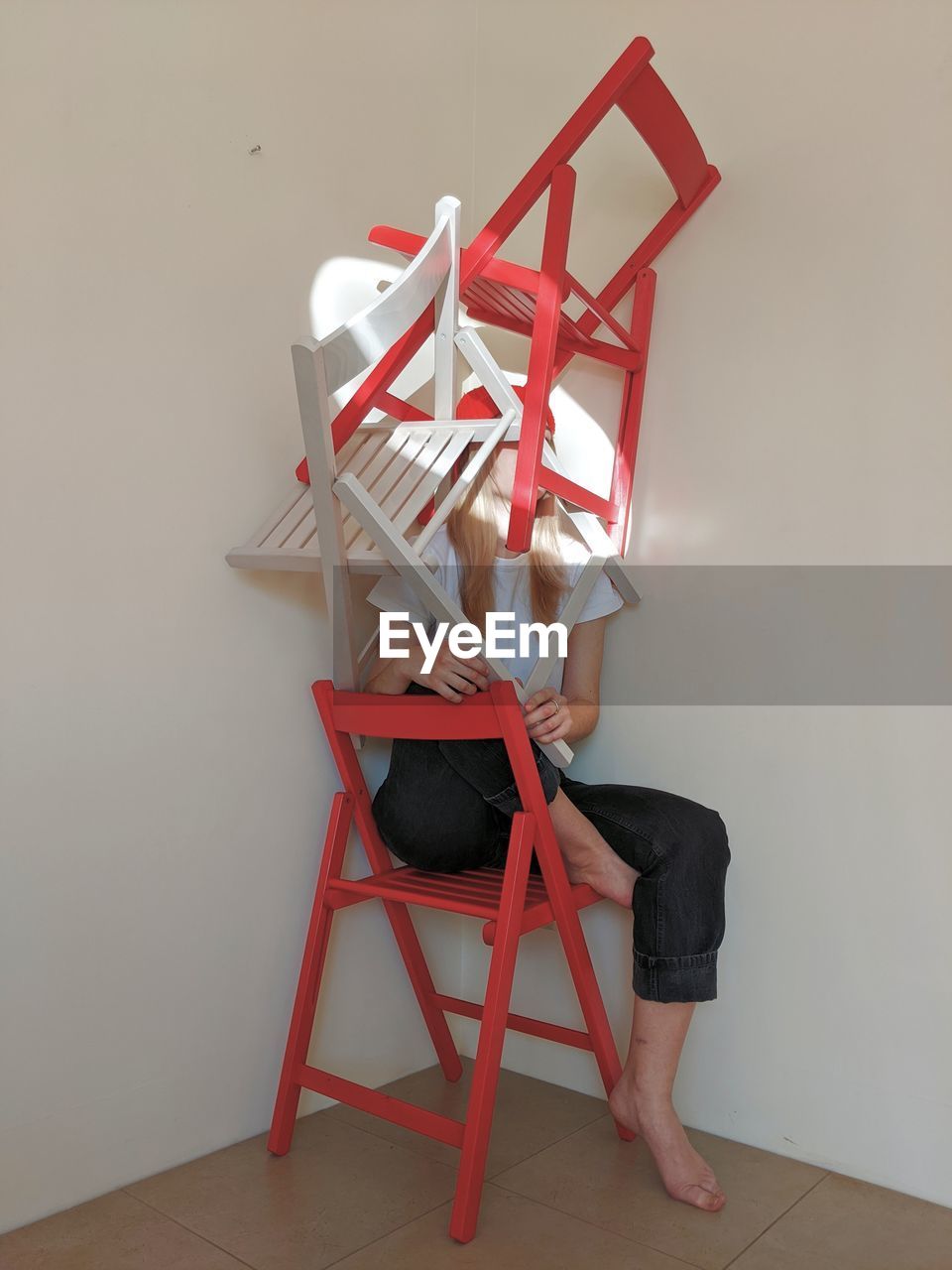 Girl sitting on chair at home