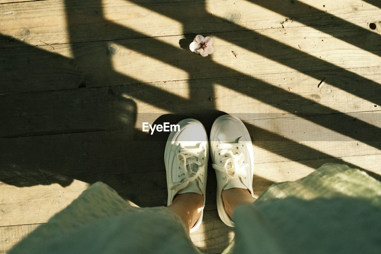 Girl standing on wooden platform