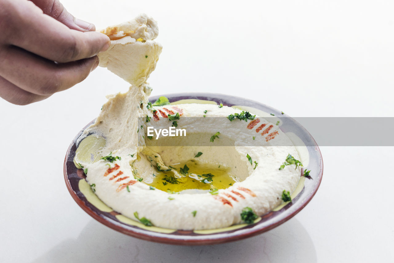 cropped hand of person having food