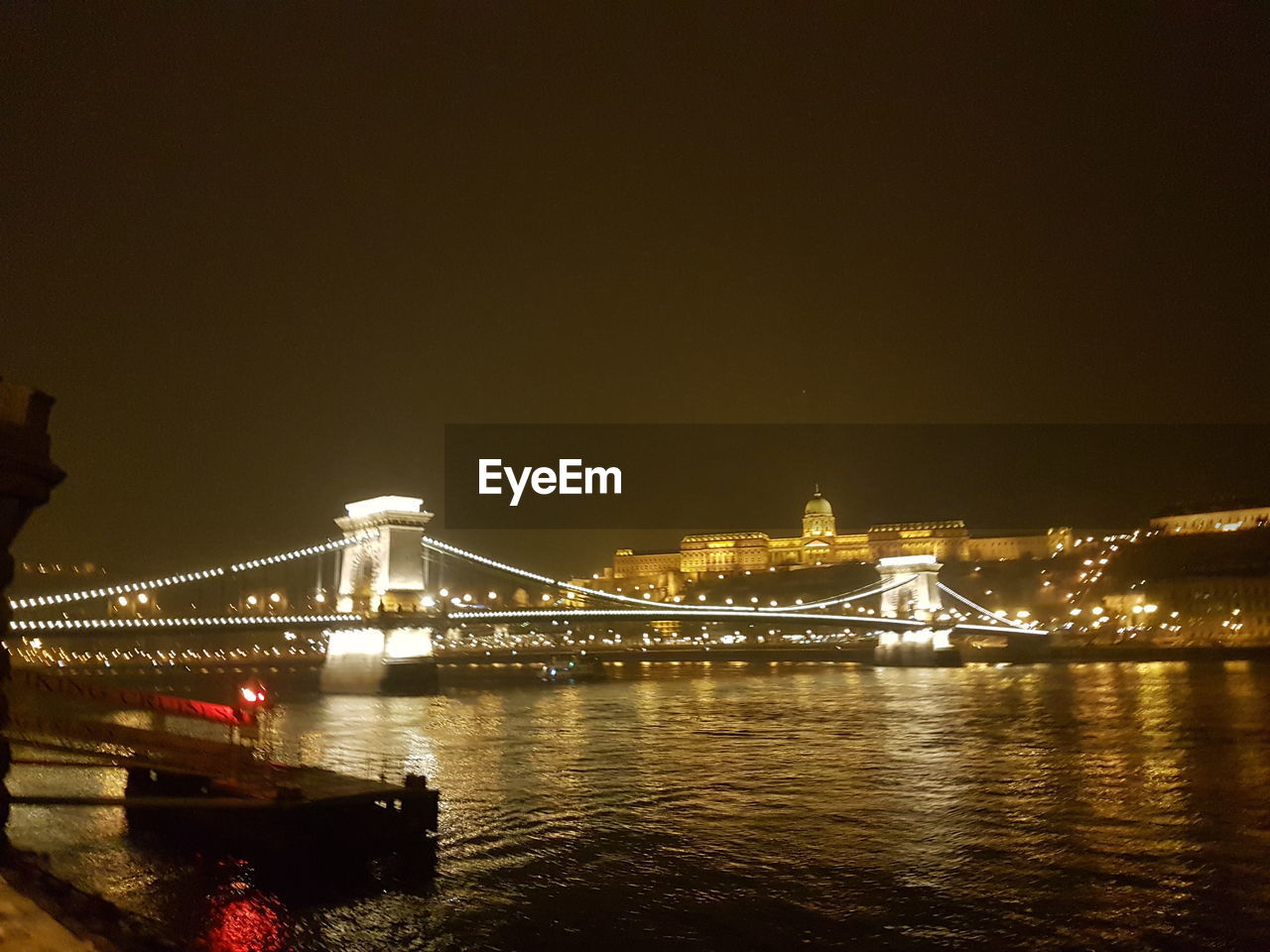 VIEW OF SUSPENSION BRIDGE AT NIGHT