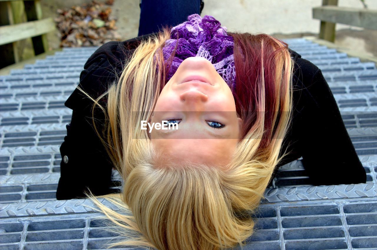 Portrait of woman sitting on steps