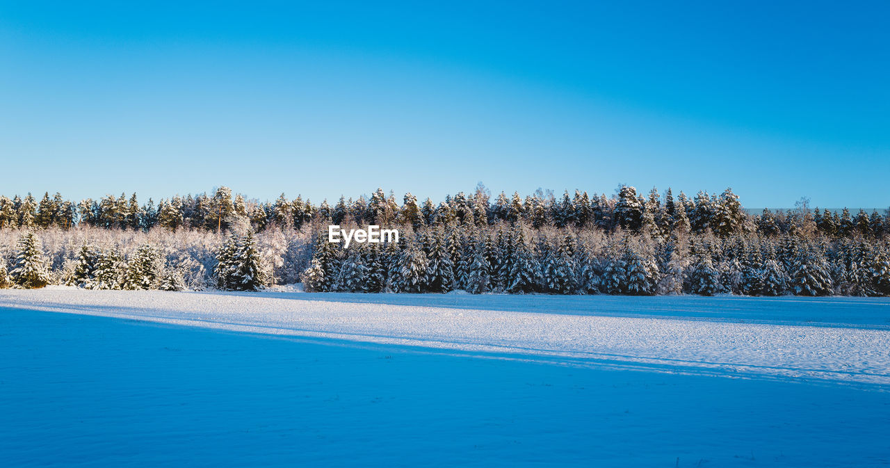 Scenic view of snowy landscape against sky