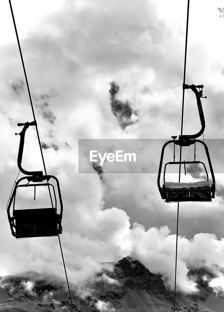 cloud, black and white, cable car, sky, monochrome photography, ski lift, overhead cable car, nature, transportation, mountain, mode of transportation, monochrome, hanging, travel, day, cloudscape, no people, outdoors, landscape, journey, scenics - nature, beauty in nature, snow
