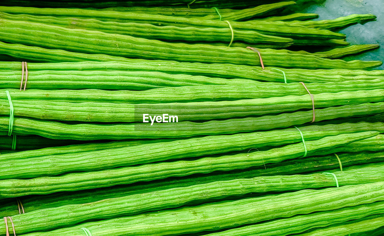 green, food and drink, food, vegetable, freshness, healthy eating, wellbeing, produce, no people, large group of objects, organic, plant stem, abundance, market, raw food, still life, retail, backgrounds, nature, asparagus, bundle, for sale, close-up, bunch, plant, full frame