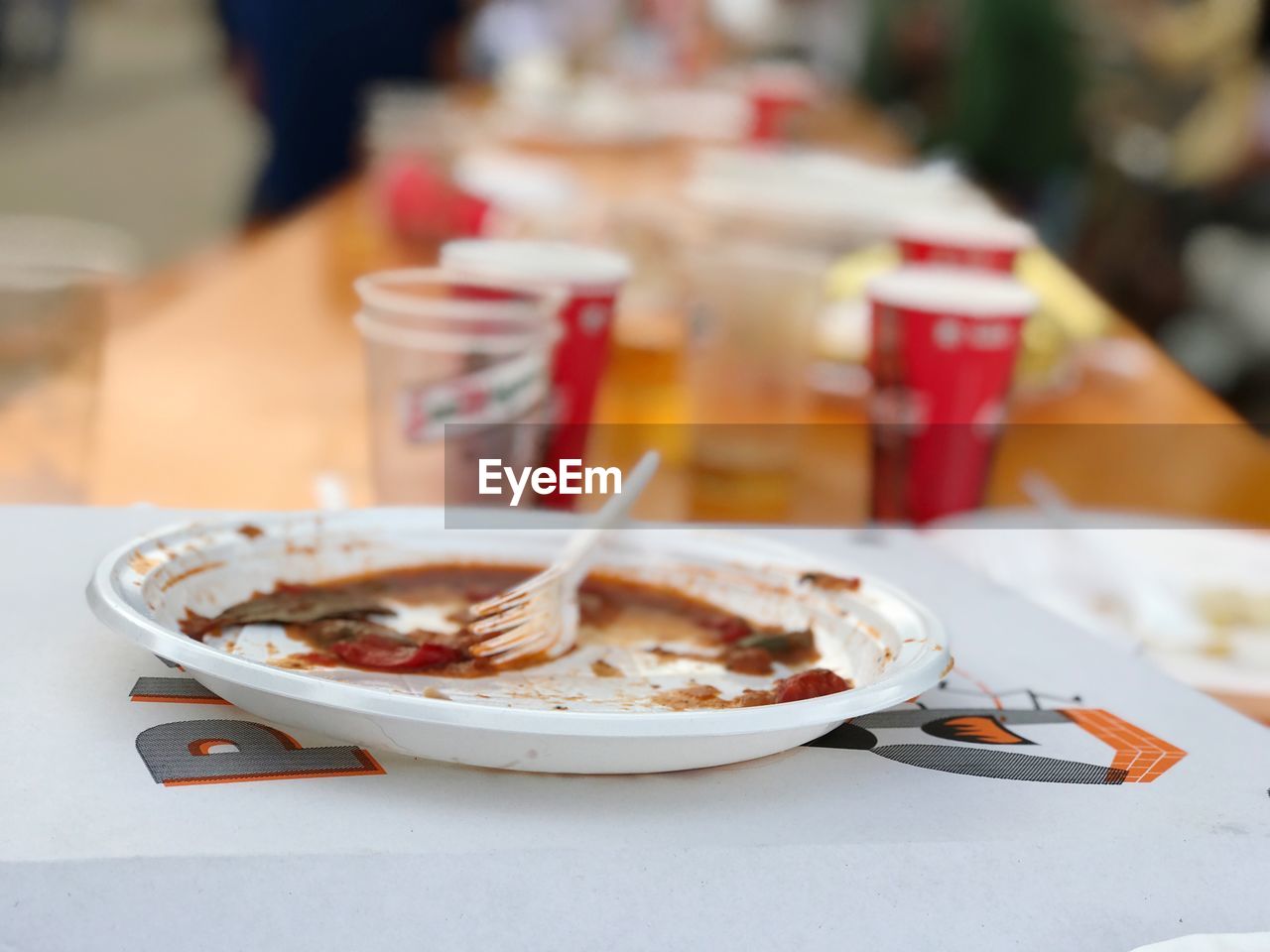Close-up of leftover food in plate on table