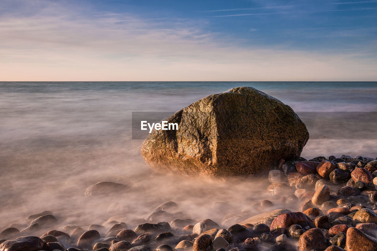 Scenic view of sea against sky at sunset