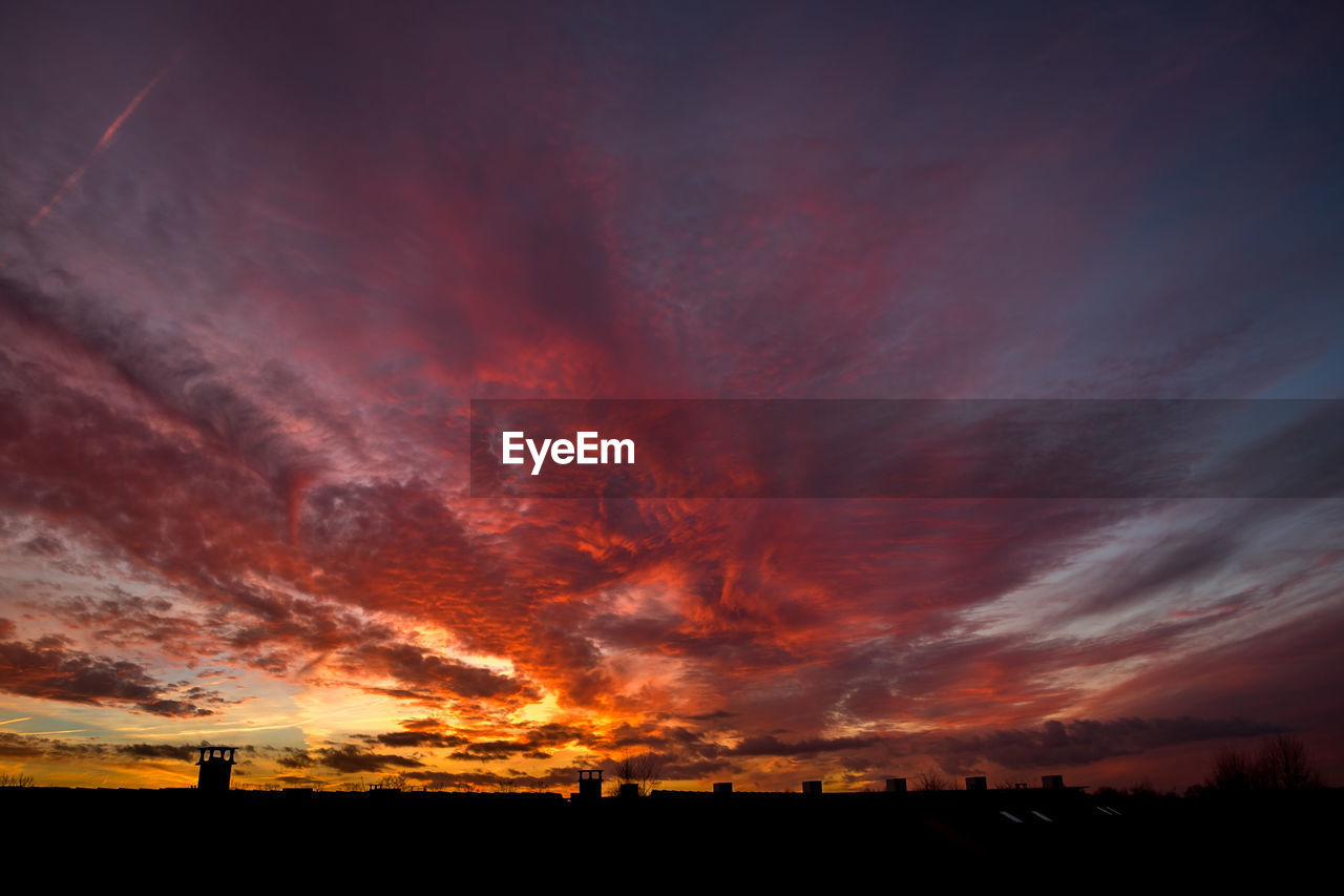 Colored sunset - ephemeral composition of clouds laid like a vortex.