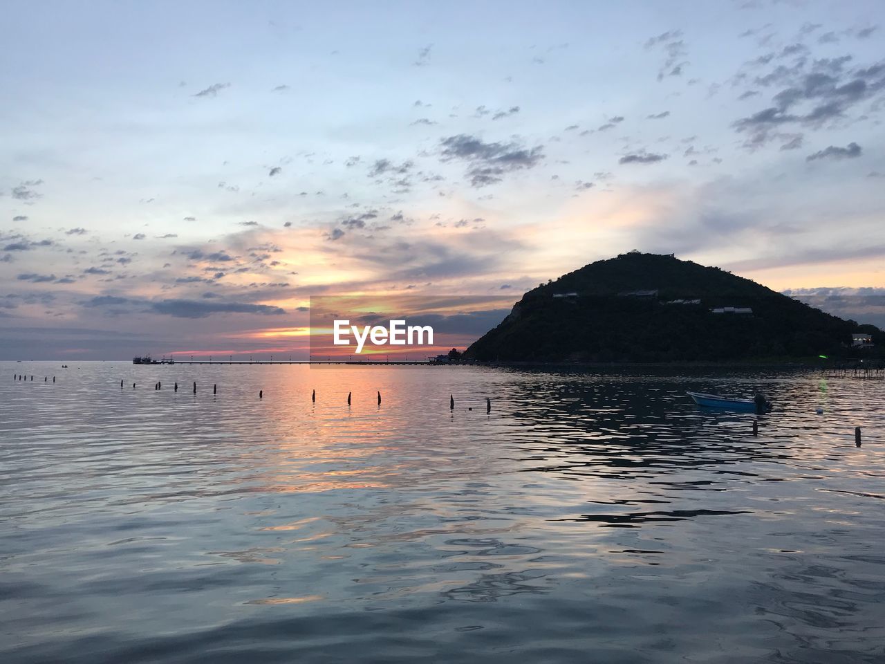 Scenic view of sea against sky at sunset