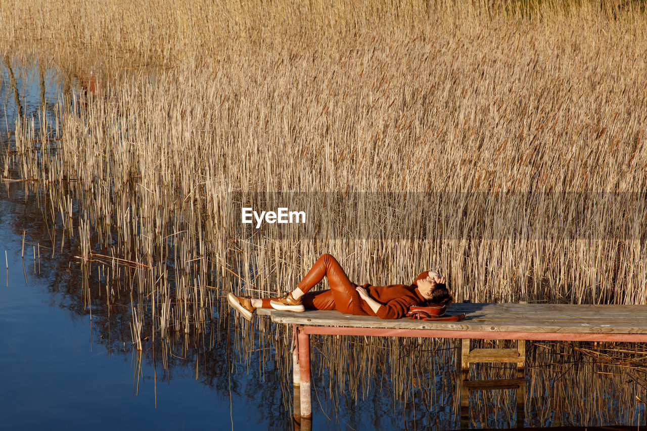 Woman lying down in water