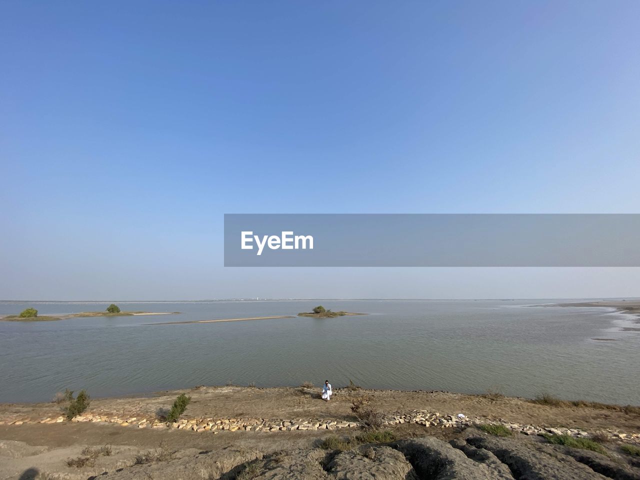 Scenic view of sea against clear blue sky