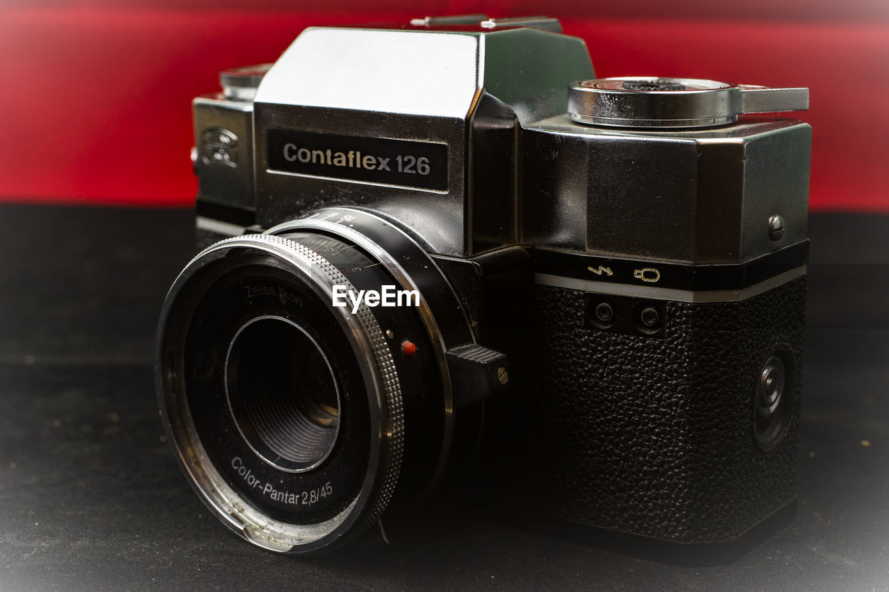 CLOSE-UP OF CAMERA ON METAL TABLE