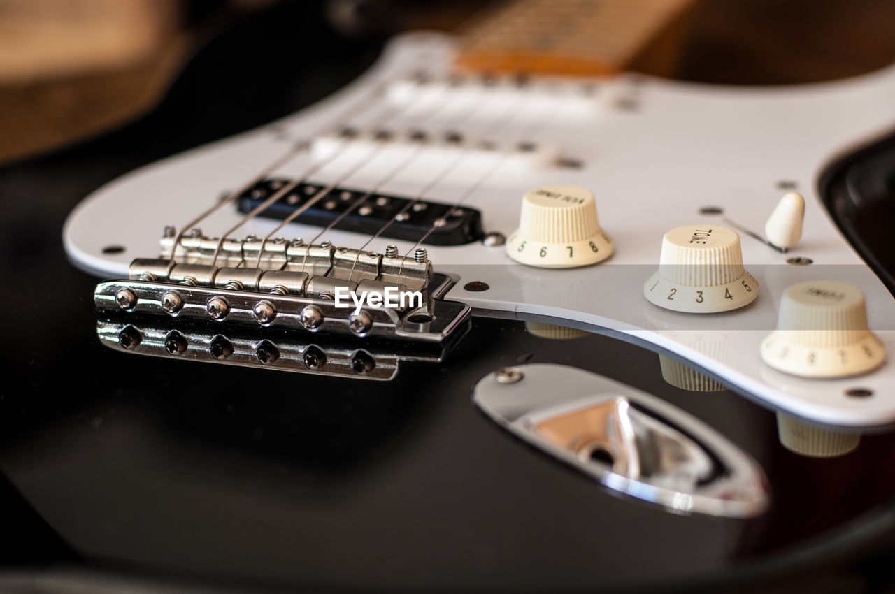 HIGH ANGLE VIEW OF GUITAR AND CAMERA