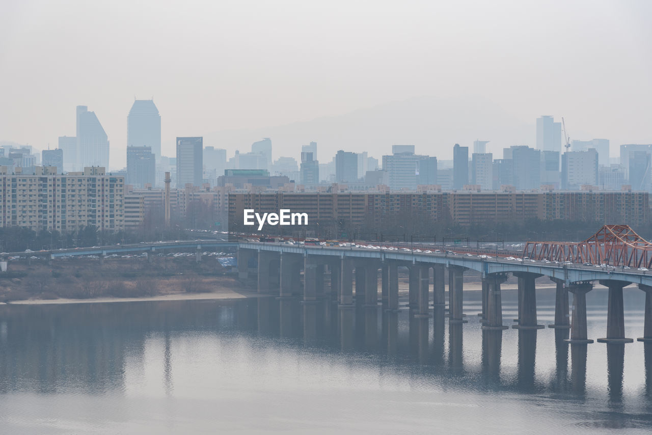 view of bridge over river in city