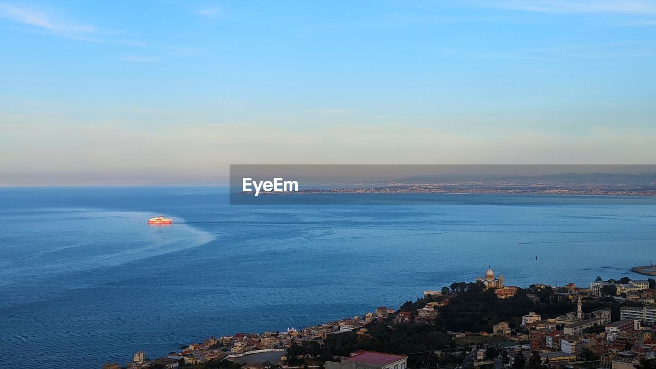 Scenic view of sea against blue sky