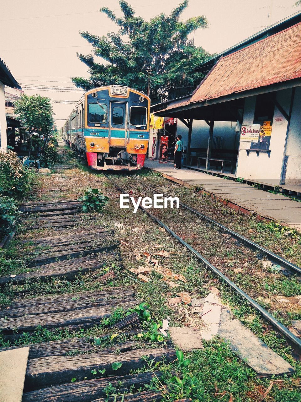 Woman waiting for train at station