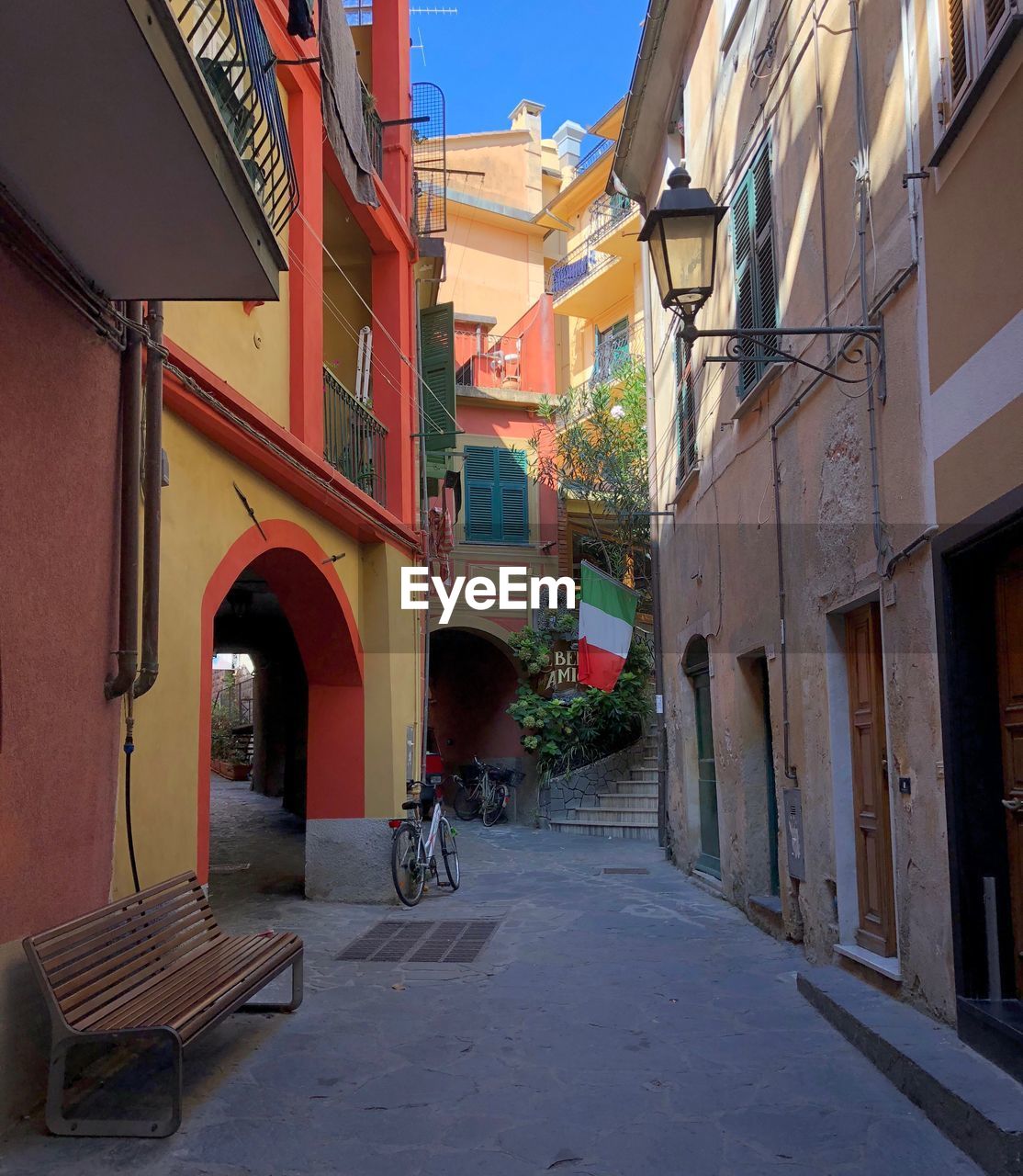 Narrow street amidst buildings in city