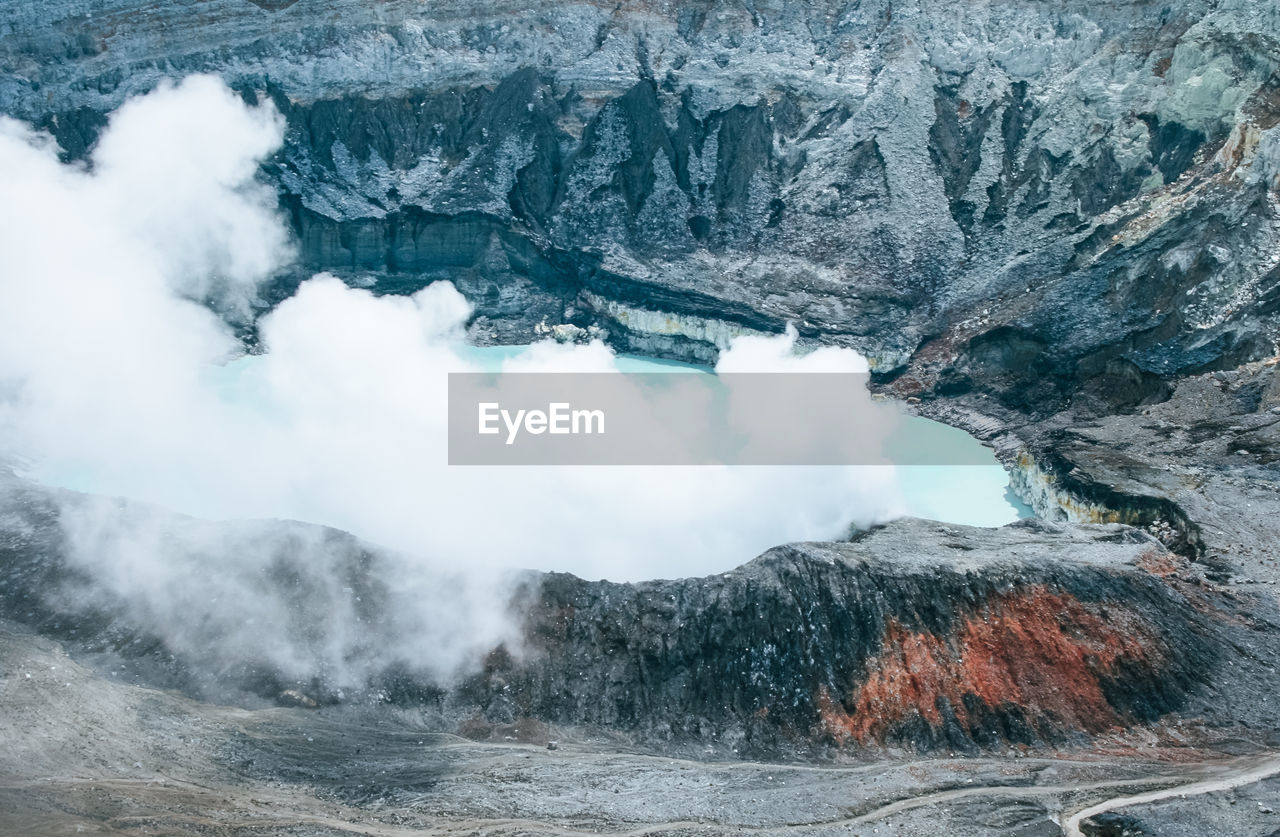 High angle view of lake amidst rock formation