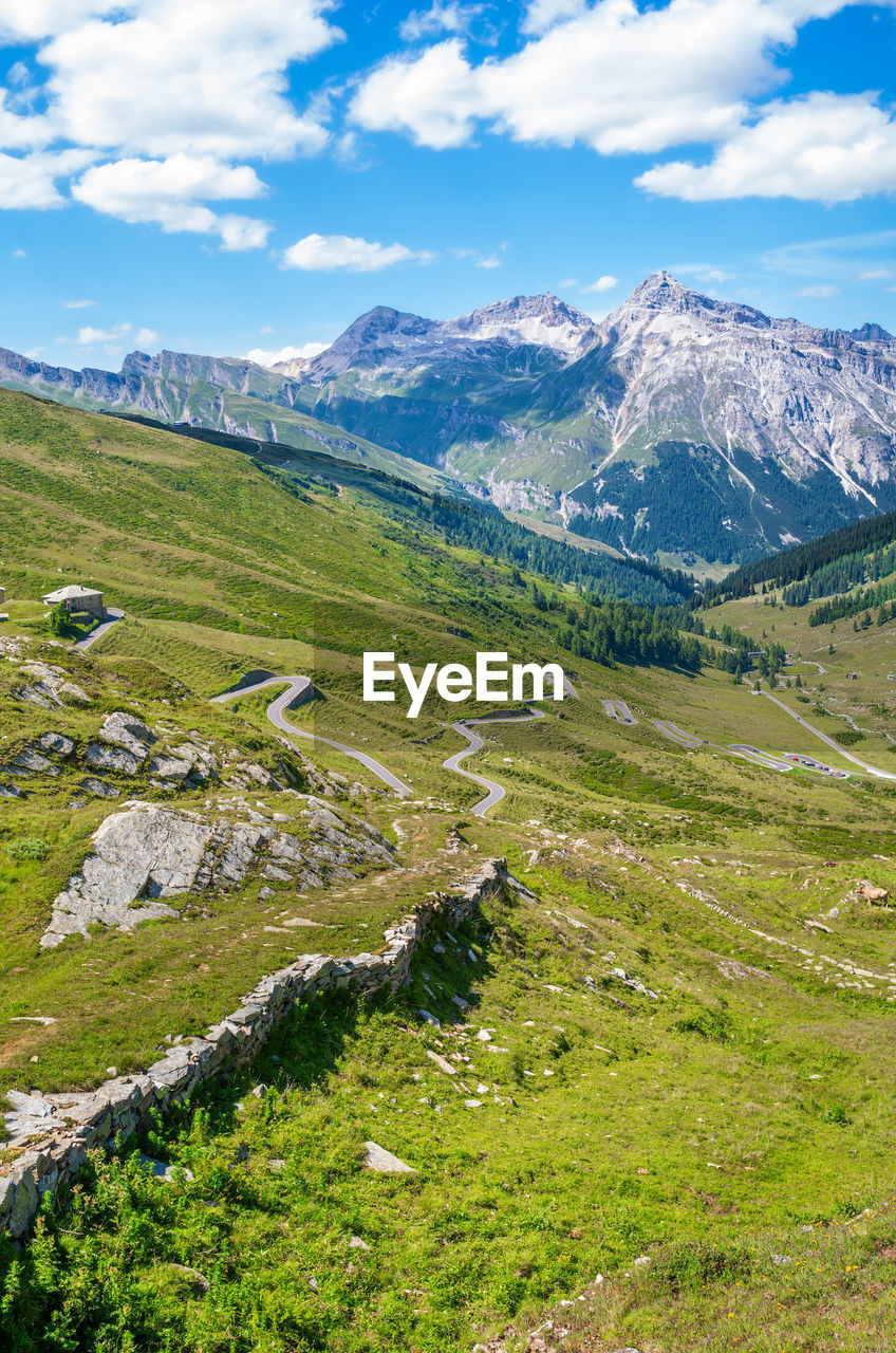 scenic view of landscape and mountains against sky