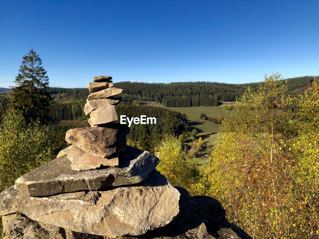 STONE STACK ON ROCK AGAINST CLEAR SKY