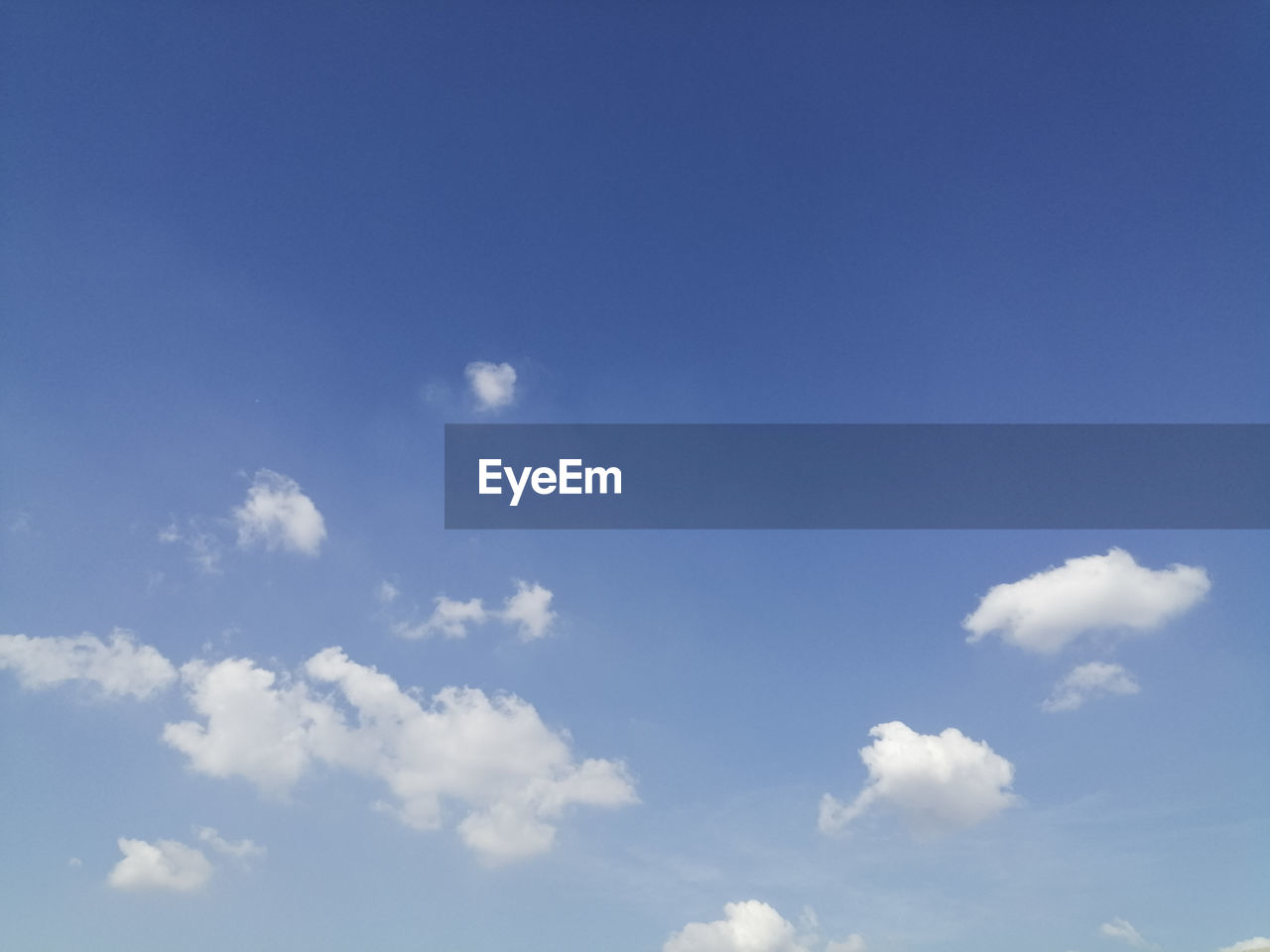 LOW ANGLE VIEW OF CLOUDS IN BLUE SKY