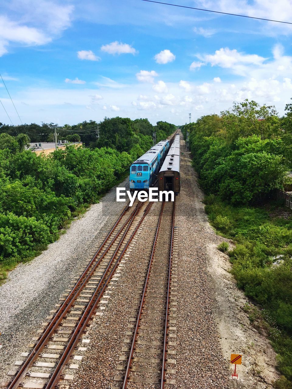 Train on railroad track against sky