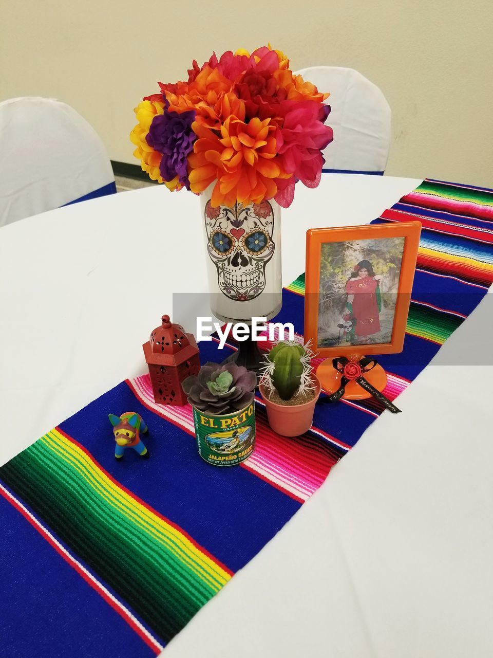 HIGH ANGLE VIEW OF MULTI COLORED FLOWERS ON TABLE