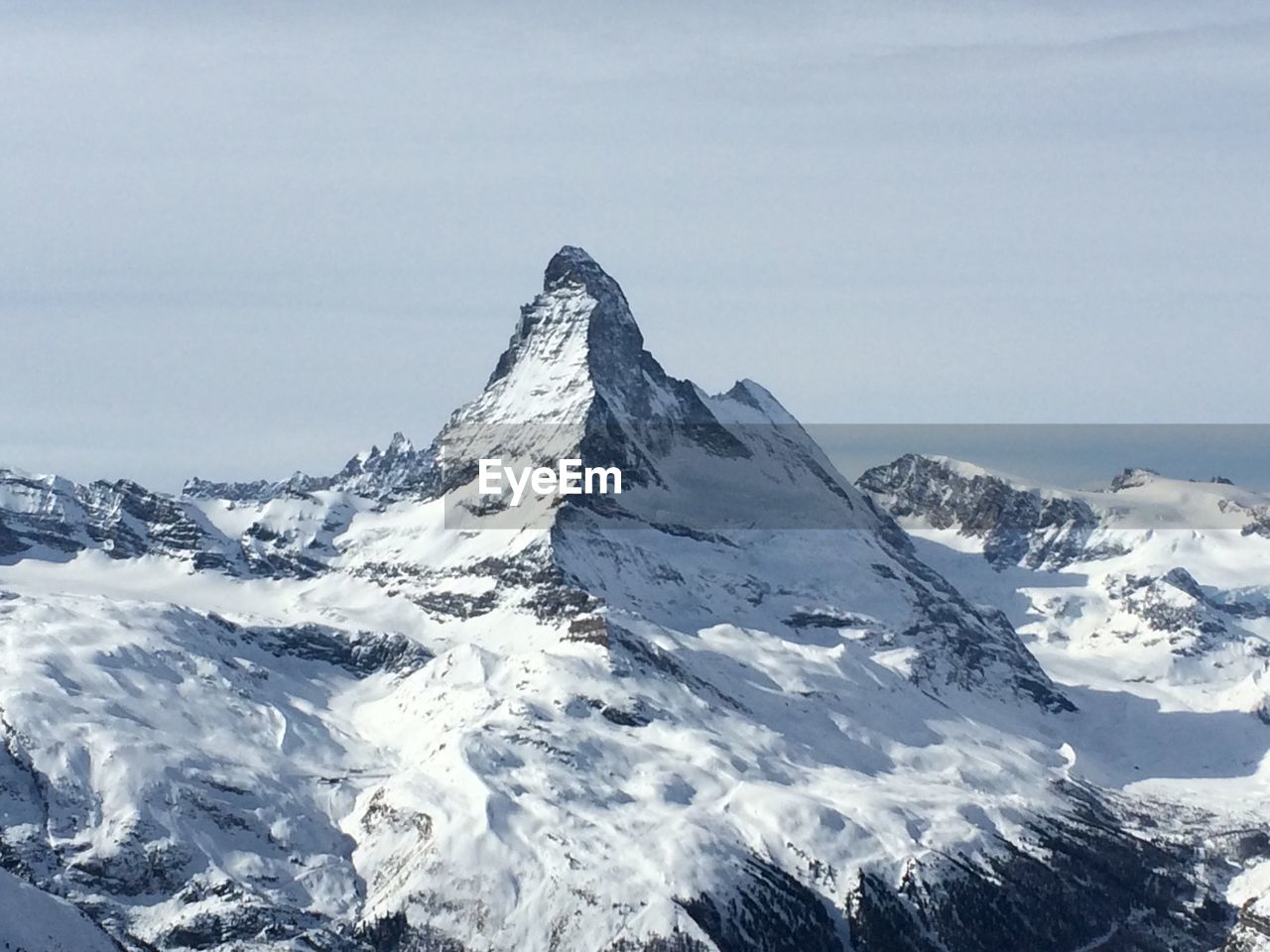 Scenic view of snowcapped mountain against sky