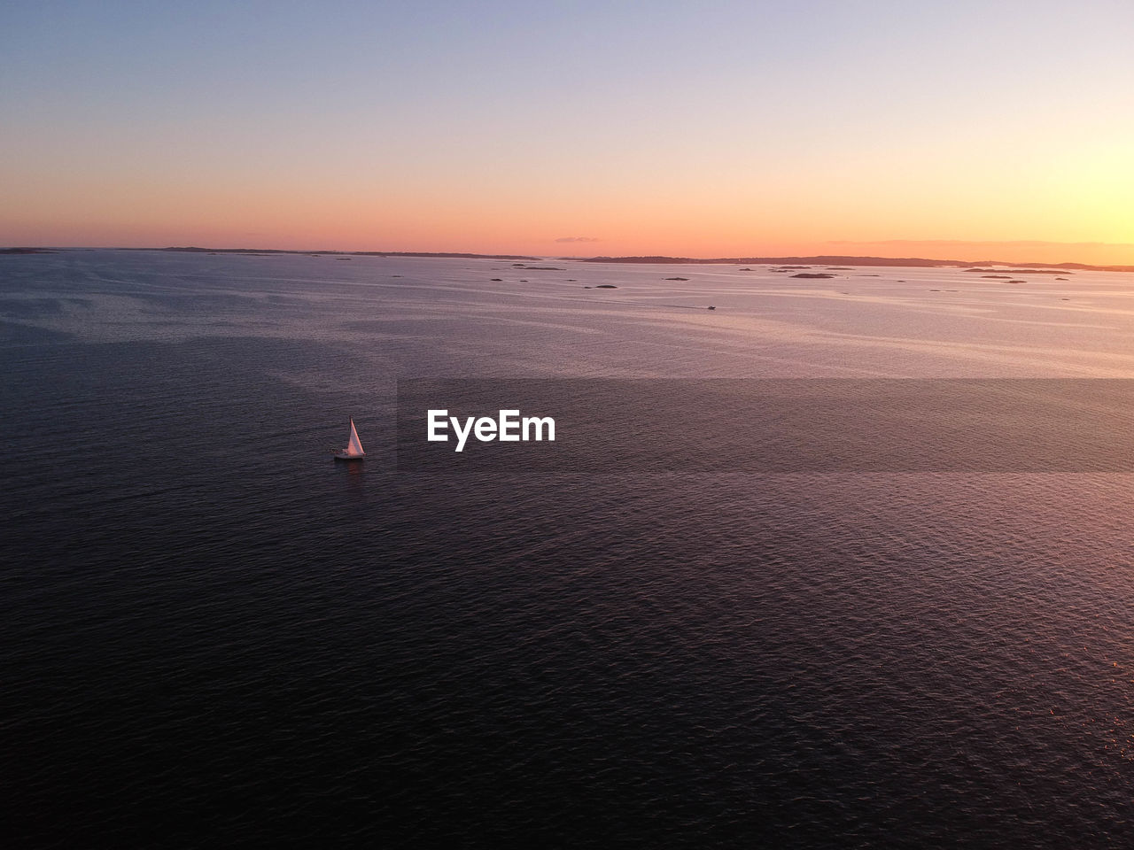 SCENIC VIEW OF SEA DURING SUNSET