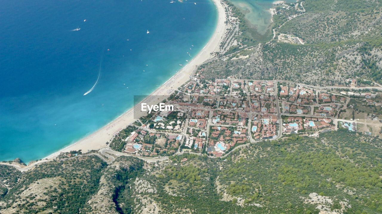 High angle view of beach and buildings in holiday resort