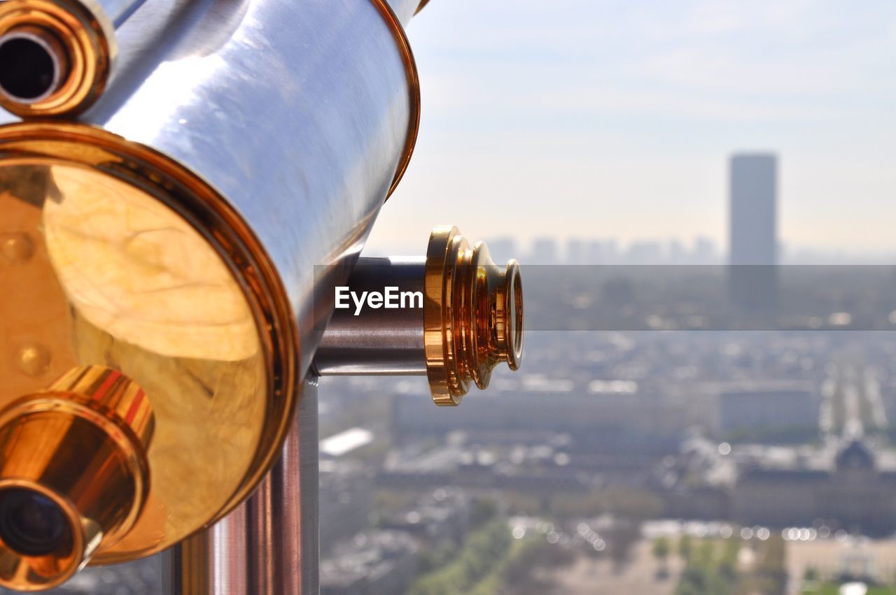 Close-up of coin-operated binoculars on sunny day