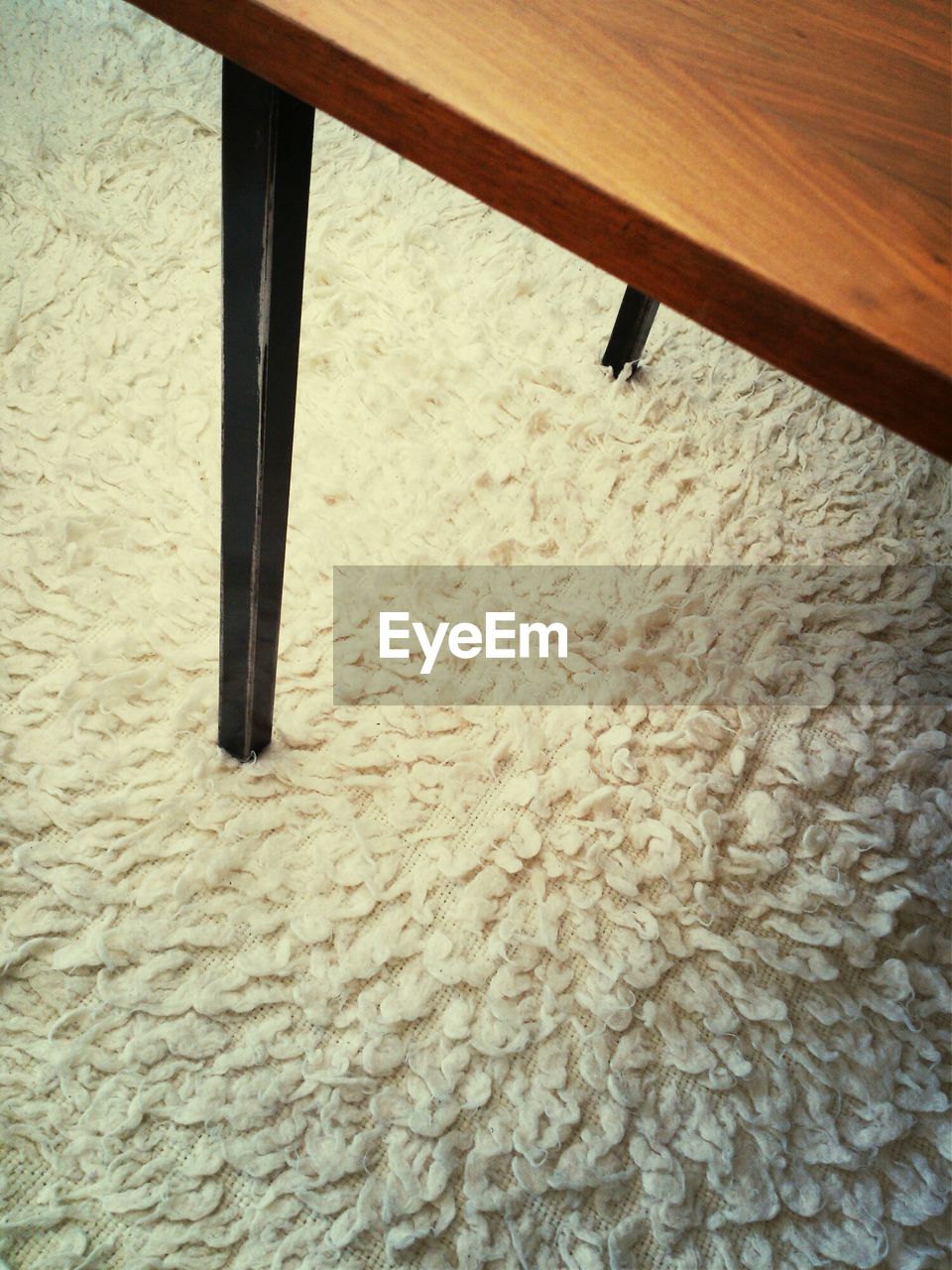 High angle view of table on carpet at home