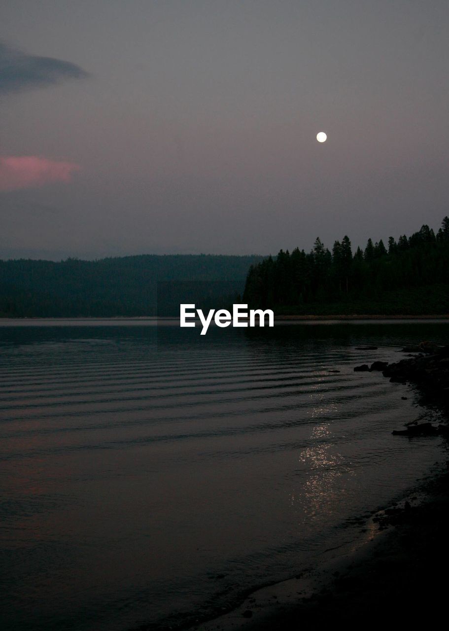 SCENIC VIEW OF MOON AT SUNSET