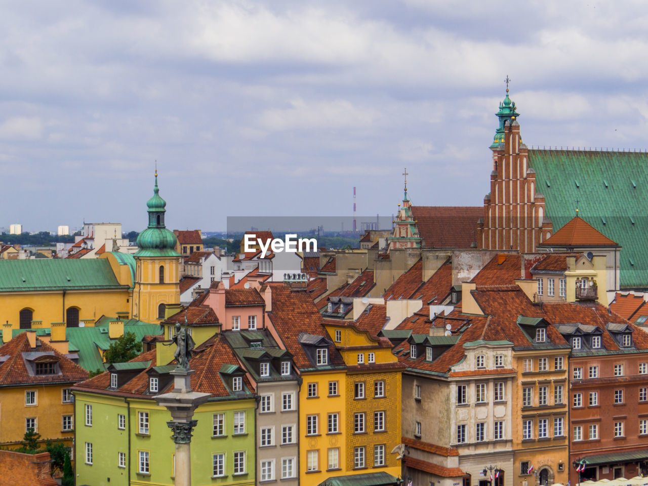 buildings in town against sky