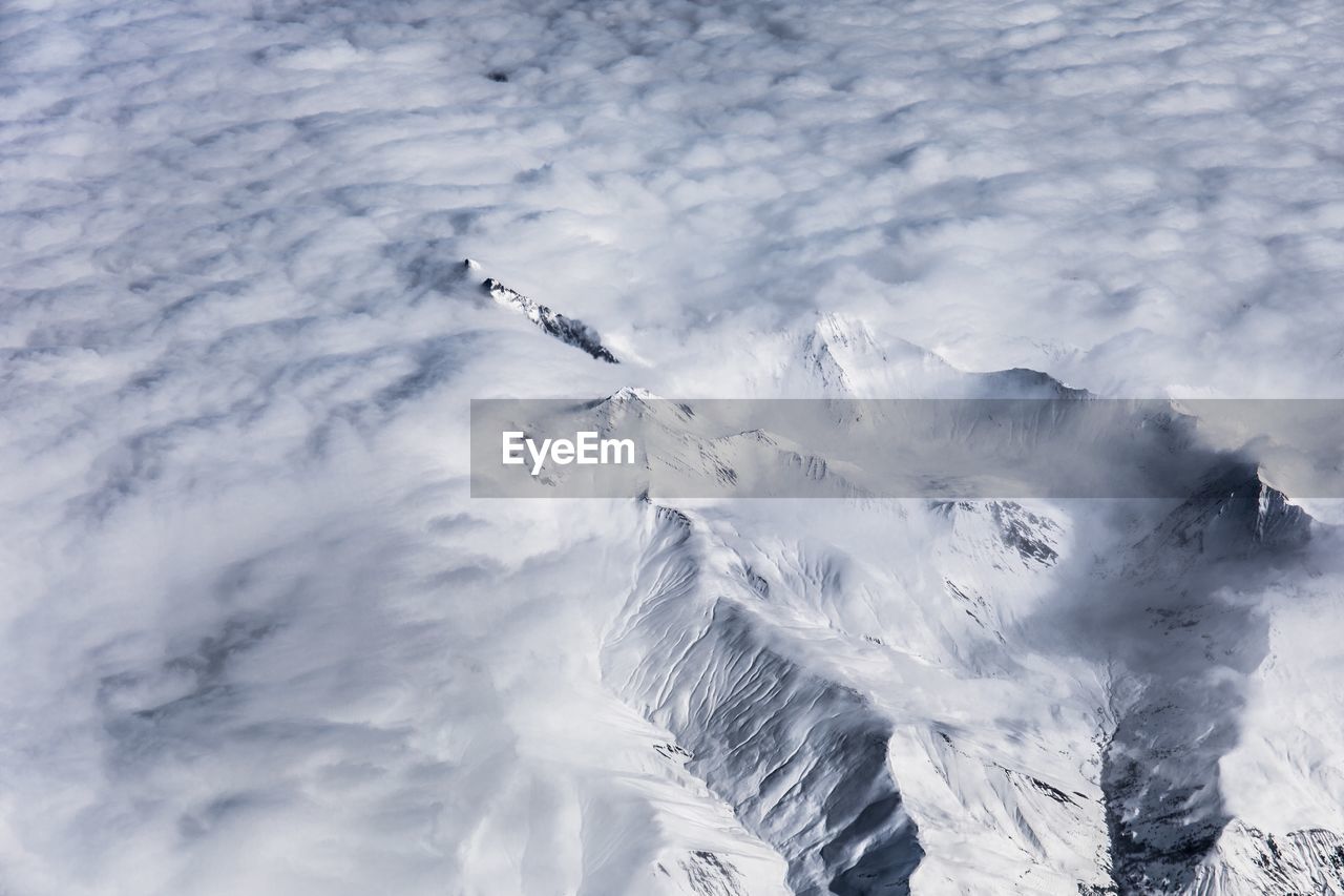 High angle view of snow on mountain against sky