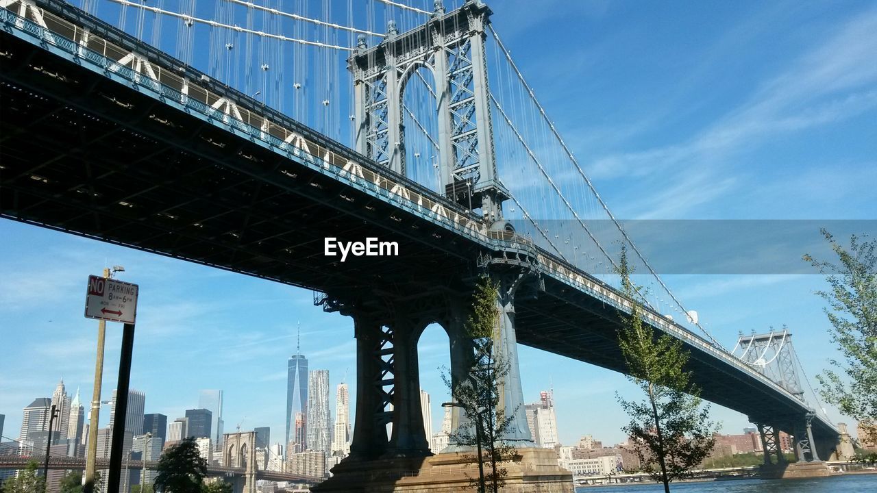 Manhattan bridge over east river against modern buildings at manhattan