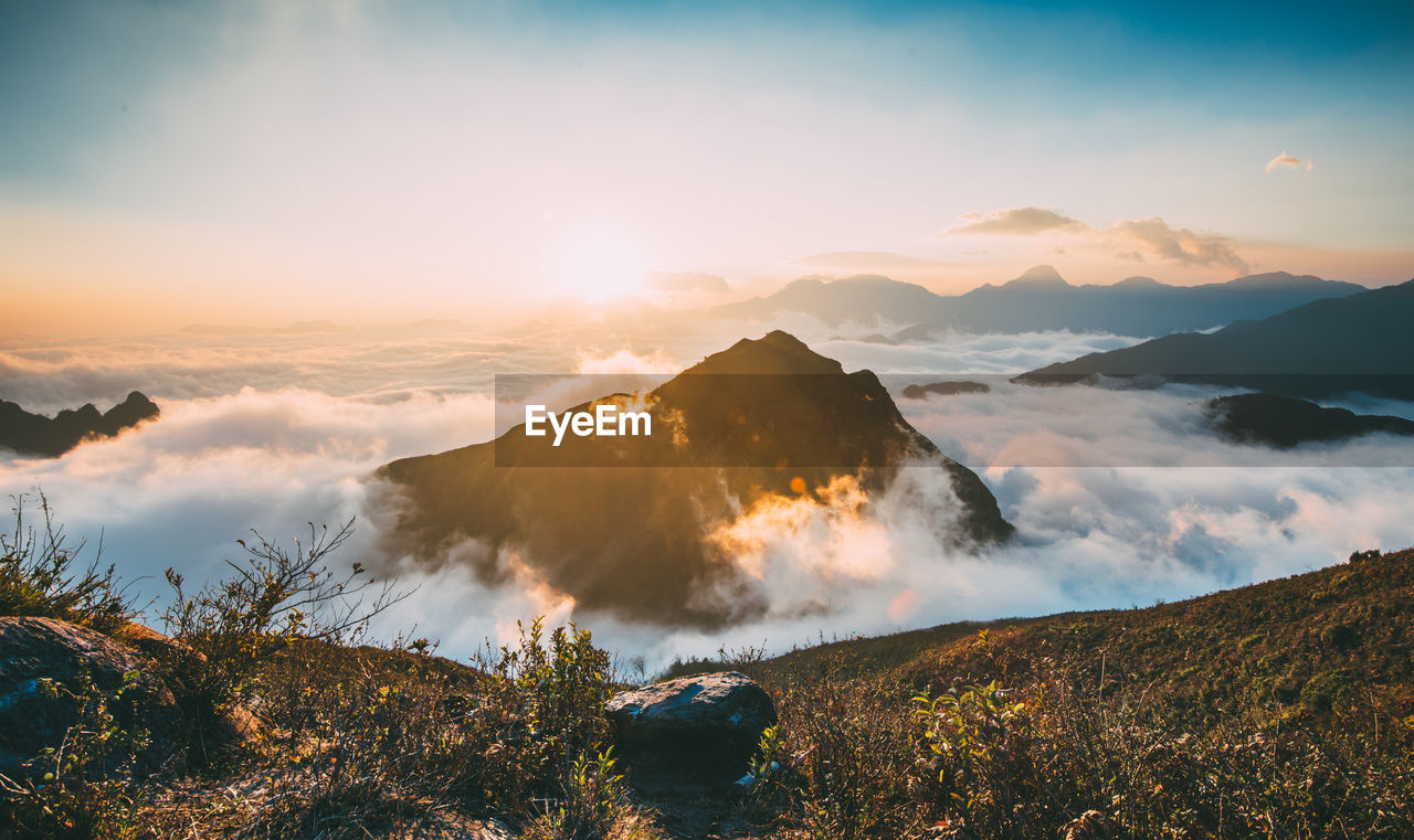 Scenic view of mountains against sky during sunset