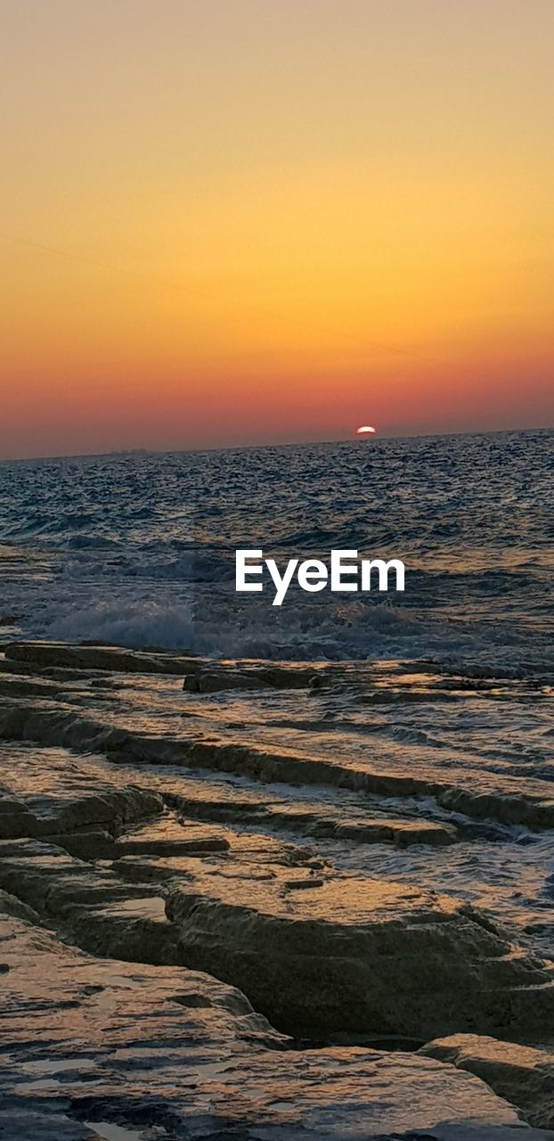 SCENIC VIEW OF SEA AGAINST ROMANTIC SKY