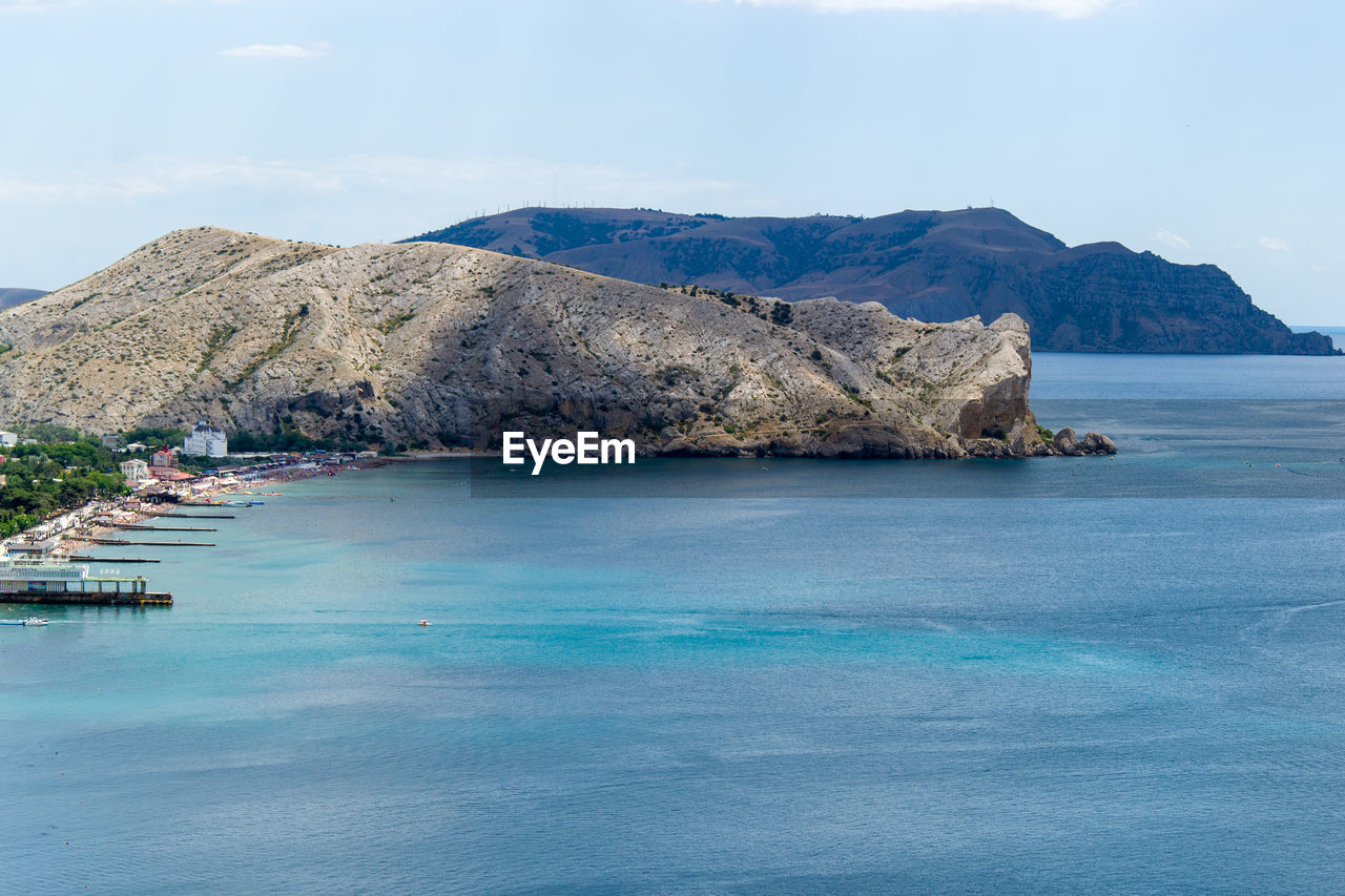 Scenic view of sea and bay against sky